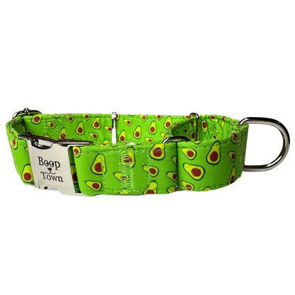 Green dog collar with avocado pattern and 'Boop Town' tag on a white background