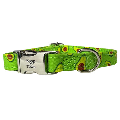 Dog collar with avocado pattern and 'Boop Town' buckle on a white background